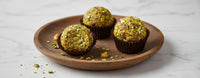 Dry fruit laddu showing almonds, cashews, pistachios and gulkand texture