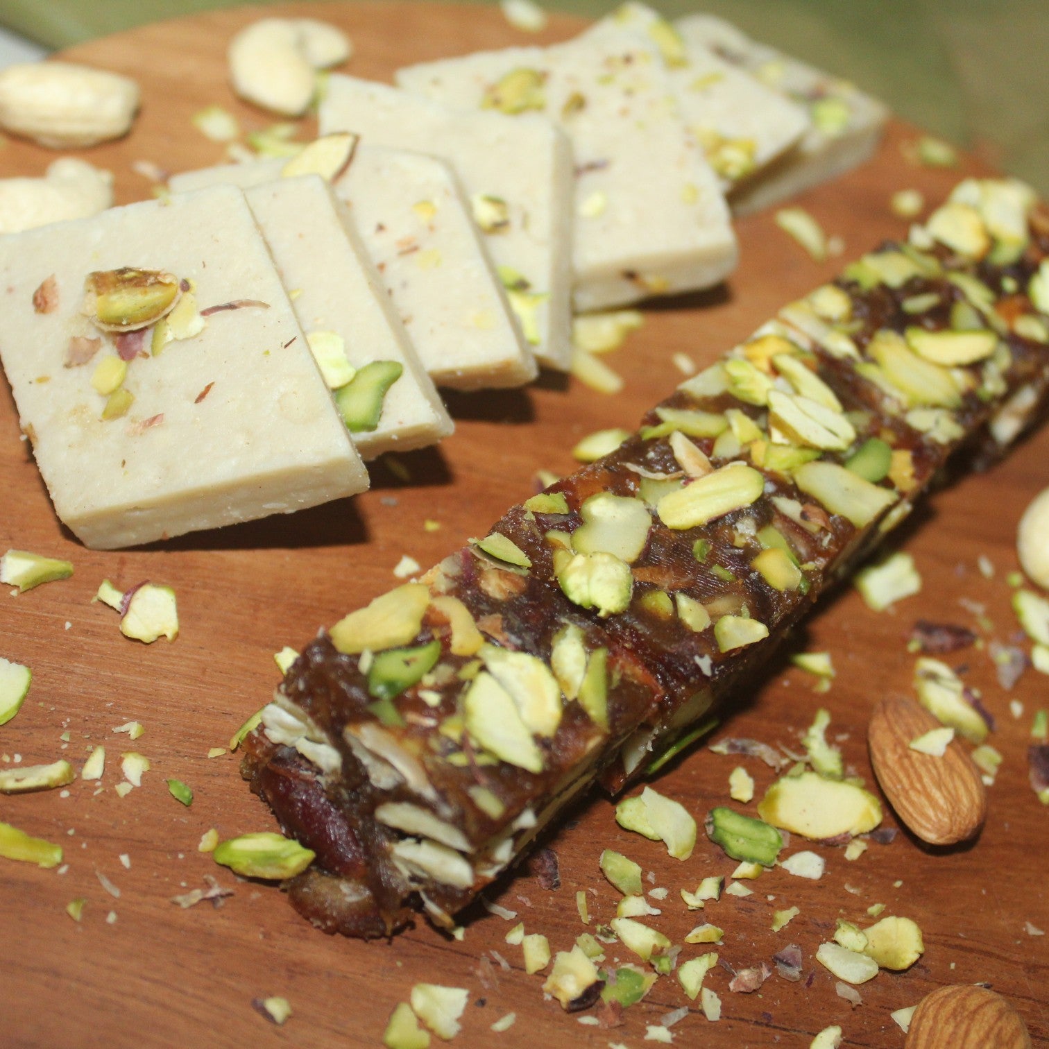 Dessert bars with nuts on a wooden surface